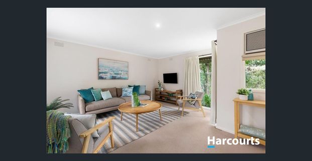 Elegant Brick Home with Serene Garden Surrounds - Photo 1