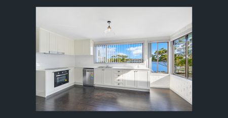 Beautiful Family Home with Elevated Water Outlook - Photo 5