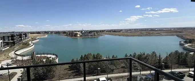 TOP FLOOR BRAND NEW EXECUTIVE CONDO WITH UNOBSTRUCTED VIEW OF MAHOGANY LAKE | 1802 Mahogany Boulevard Southeast, Calgary - Photo 1