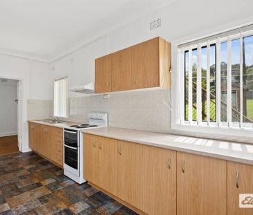 Neat & Tidy Family Home | Split-Level Living in Prime Location - Photo 3