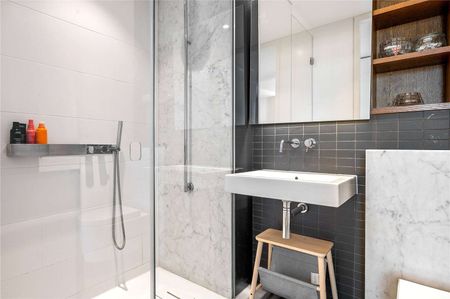 A top floor two bedroom apartment with stunning views in the Barts Square development. - Photo 2