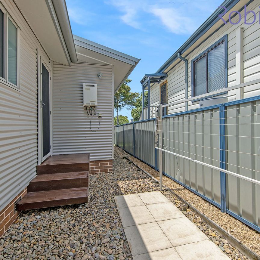 Three bedroom, two bathroom townhouse with double auto-door garage - Photo 1