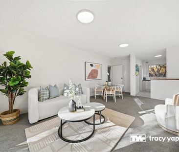 Roomy two bedroom unit located in quiet security block! - Photo 1
