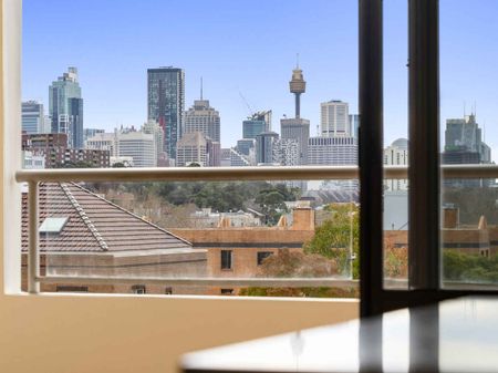 NEWLY UPDATED NORTH FACING SPLIT LEVEL TWO BEDROOM APARTMENT WITH CITY VIEWS - Photo 2