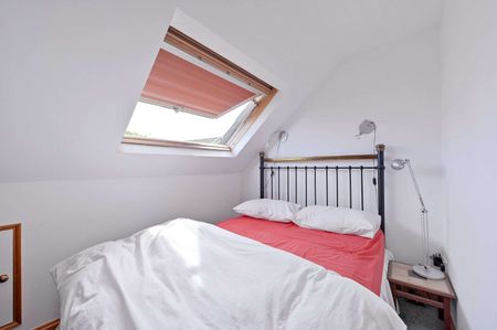 A beautifully presented, fully furnished two-bedroom top-floor apartment, combining character, contemporary loft-style living and exceptional proportions, with stunning views to the rear. - Photo 5
