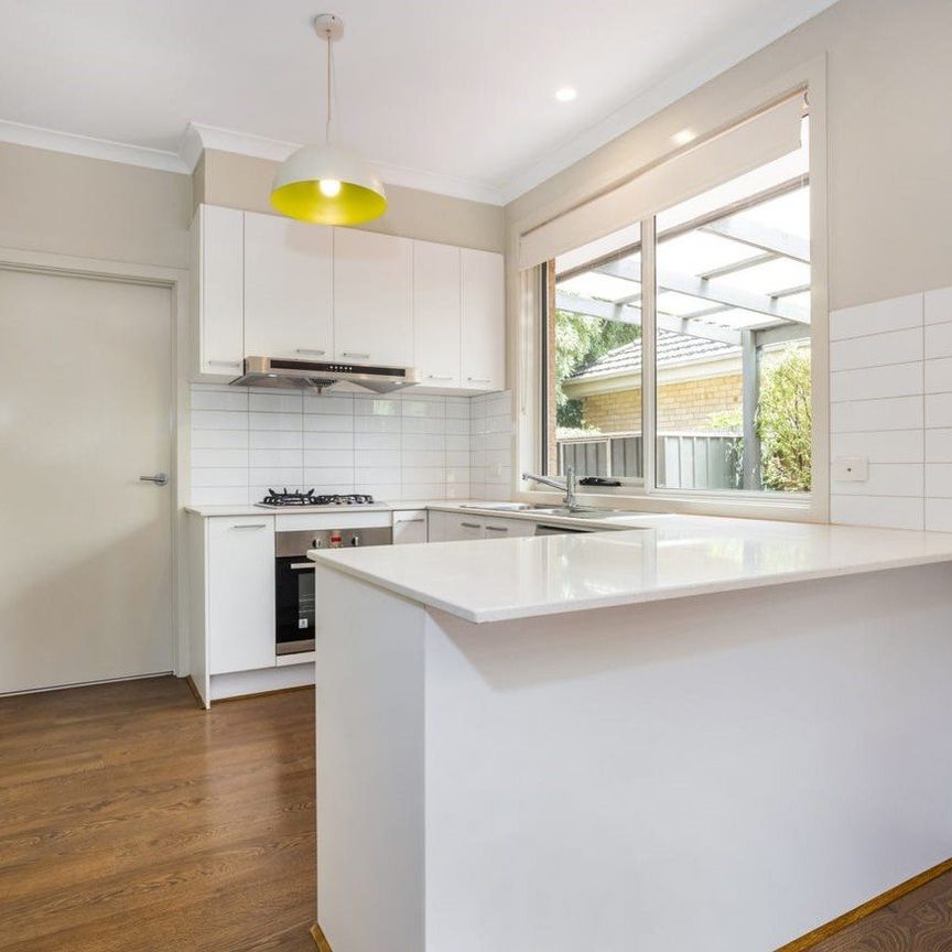 Immaculate Townhouse Ideal for Family Living - Photo 1