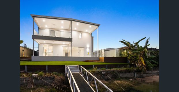 Unfurnished Brand New Waterfront Home with Dual Living - Photo 1