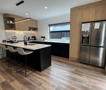 Nestled in the heart of Queenwood, this modern three-bedroom, two-b... - Photo 1