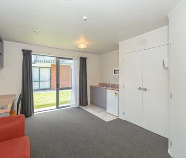 These fully furnished studio units boast fresh carpet and paint, cr... - Photo 4