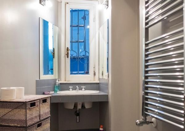 Attic-Monti: Spacious, furnished 3 Bedroom, 2 bath, living room, dining room, study and large panoramic terrace. Bright, silent, located in well kept Palazzo d’Epoca with elevator and doorman. Near transport and Metro.