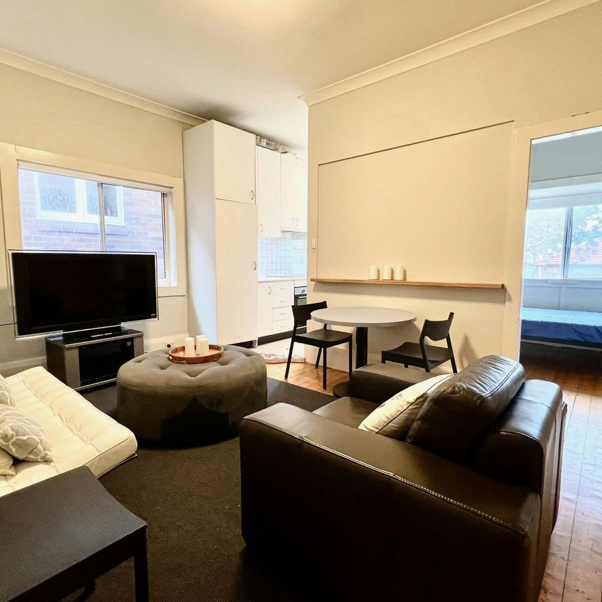 Furnished top floor 2 bedroom unit with polished boards - Photo 1