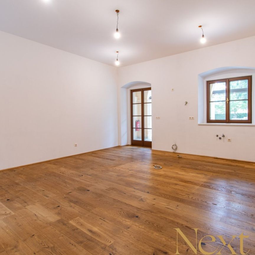 Charmante 2,5-Zimmer-Wohnung mit gemütlichem Eigengarten im Palais Löwenfeld ab sofort zu vermieten! - Photo 1