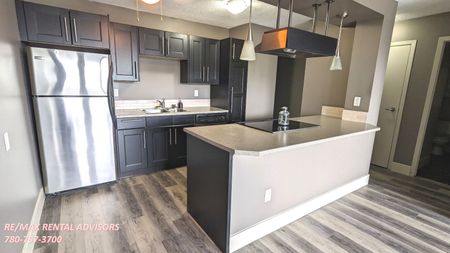 GREAT 1 BED, 1 BATH 4th-FLOOR APARTMENT W/AN UNDERGROUND PARKING STALL IN THE COMMUNITY OF CLIFF BUNGALOW - Photo 3