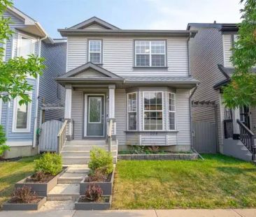 A spacious open-concept home featuring 4 bedrooms, 2 full bathrooms, 2 half bathrooms, and a double garage. | 104 Prestwick Villas Southeast, Calgary - Photo 1