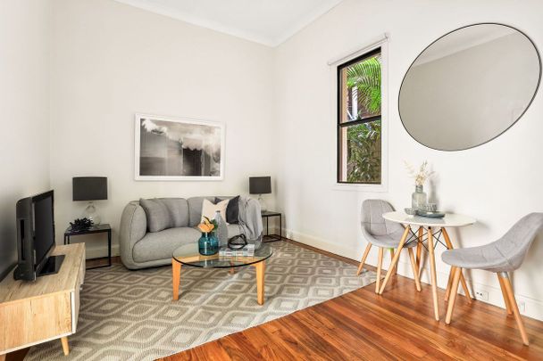 Sleek & Convenient Apartment with an Iconic Address - Photo 1