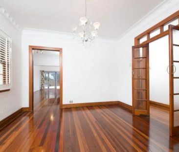 Elegant Stucco Double Brick Home with Character and Modern Comfort - Photo 2