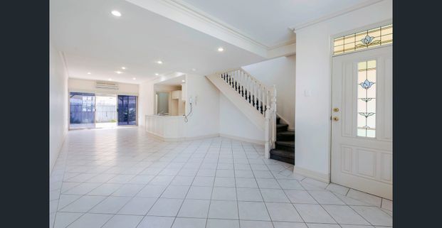 TRENDY TOWNHOUSE IN SECURE LOCATION! - Photo 1