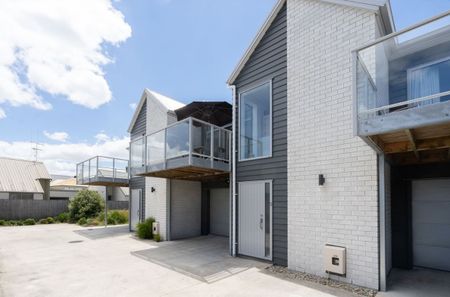 Located just minutes from Hamilton CBD, Hamilton Lake, and Waikato/Braemar Hospitals, this modern townhouse offers low-maintenance living in a highly convenient location. - Photo 2