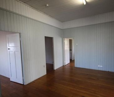 A SPACIOUS HIGH-SET HOME WITH 2 BEDROOMS PLUS ENCLOSED VERANDAS. - Photo 6