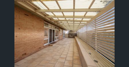 UNFURNISHED - Charming Solid-brick Home with Treetop Views - Photo 5