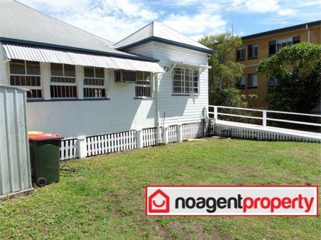 Spacious Four-Bedroom Queenslander with Timeless Charm in Clayfield - Photo 2