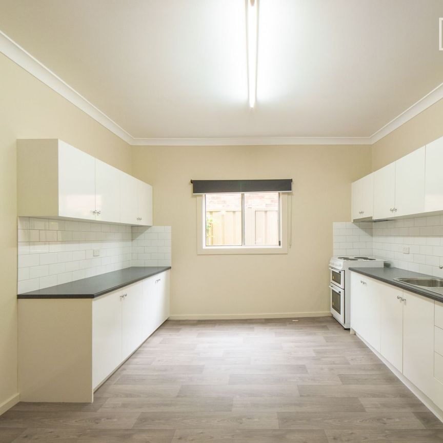 Two bedroom home with lawn maintenance included - Photo 1