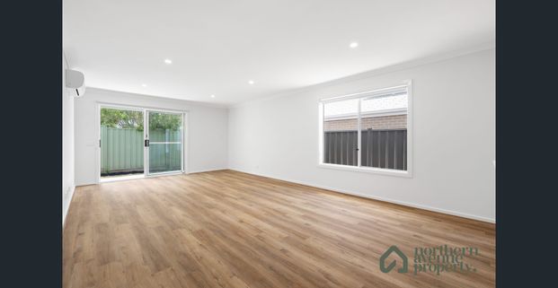 Spacious 4-Bedroom Family Home with Modern Comforts - Photo 1