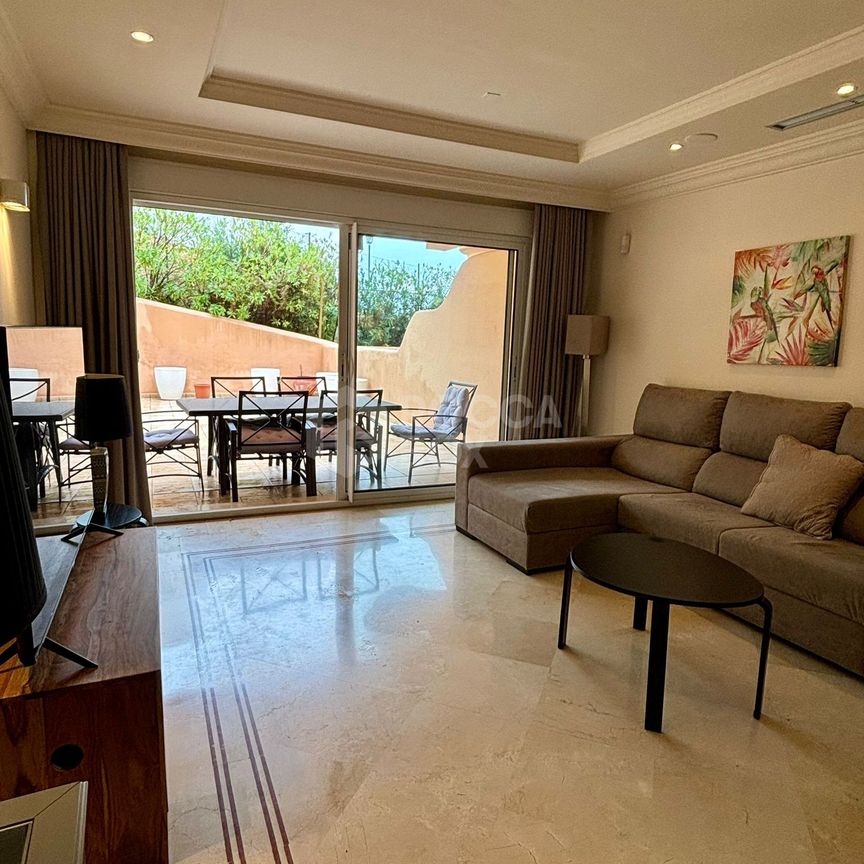 Ground Floor Apartment with Expansive Terrace and Prime Amenities - Photo 1