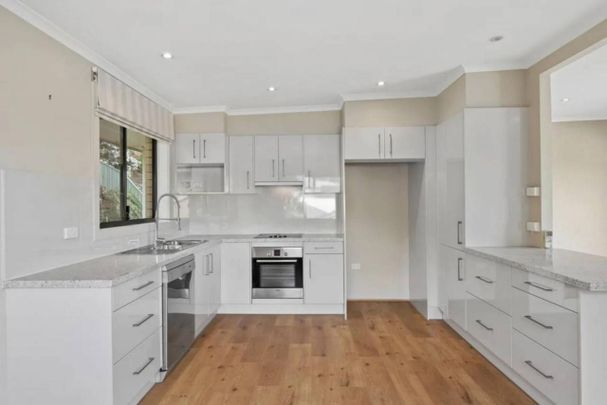 FOR RENT: WATERFRONT LIFESTYLE AWAITS! 4-Bedroom Plus Study Home with Stunning Lake Views - Photo 1