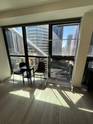 Prime Location Alert! Semi-furnished 2 Bedroom, 1 Bathroom Apartment at 1801/327 La Trobe Street, Melbourne CBD - Photo 1