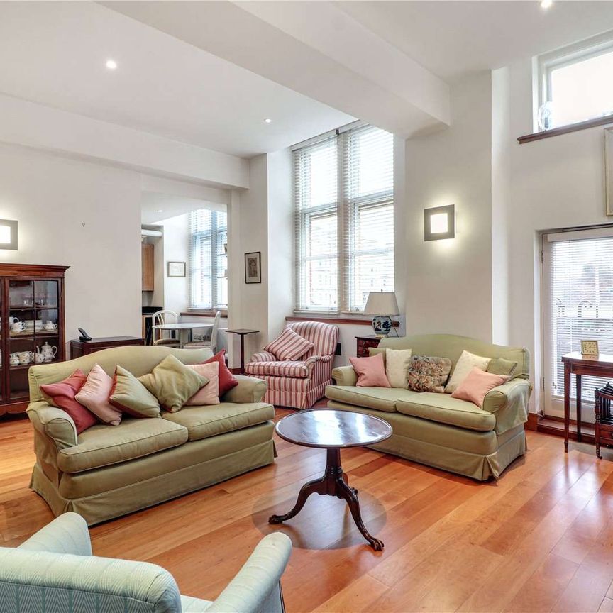 A ground floor two bedroom apartment in this centrally-located landmark building with two off street parking spaces. - Photo 1