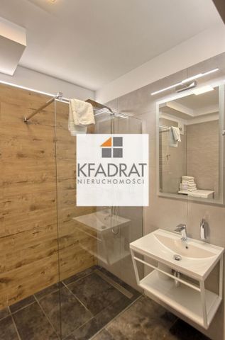 Mieszkanie 2-poziomowe na Starym Mieście - Photo 2