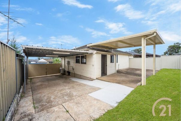 Well-Kept Family Home in a Convenient Location! - Photo 1