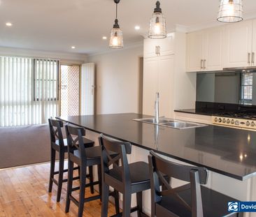 Immaculate 4-Bedroom Home with Premium Kitchen & Large Backyard - Photo 3