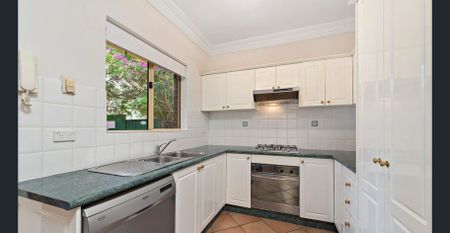 Spacious Two-Storey Townhouse in a Serene Locale - Photo 2