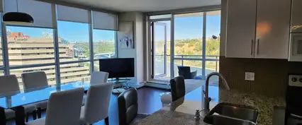 2 Bed + Den & 2 Bath Fully Furnished Waterfront Condo | 325 3 St SE, Calgary - Photo 1