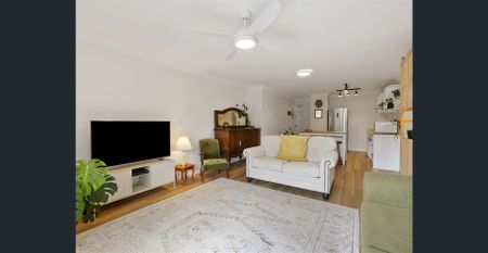 Elevated Coastal Living | Renovated Top Floor Retreat Moments from the Sand - Photo 2