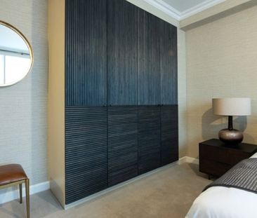 A three bedroom apartment of approximately 1,203 square feet. - Photo 2