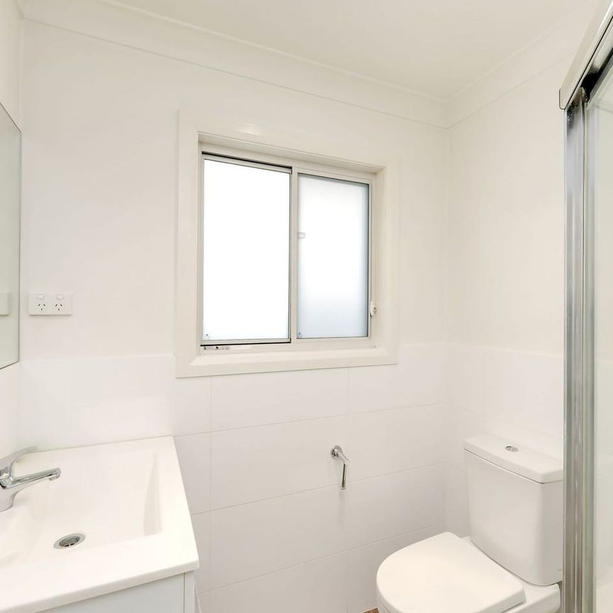 Modern Two-Bedroom Home with Lawn-Maintenance Included - Photo 1