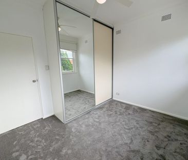 BRIGHT AND AIRY TOP FLOOR TWO BEDROOM APARTMENT - Photo 5