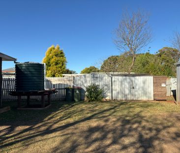 Fully fenced 2 bedder with triple shed - Photo 2