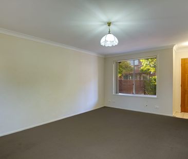 Spacious 3-Bedroom Townhouse with Family room in Secure, Quiet Complex - Photo 1