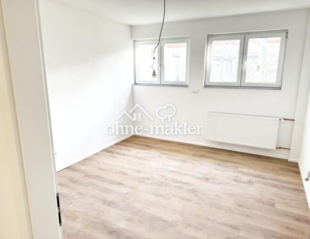 Modernisierte Erdgeschosswohnung mit Terrasse und Garten - Photo 1