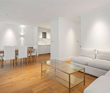 A recently refurbished two bedroom flat within a popular Spitalfields development. - Photo 2