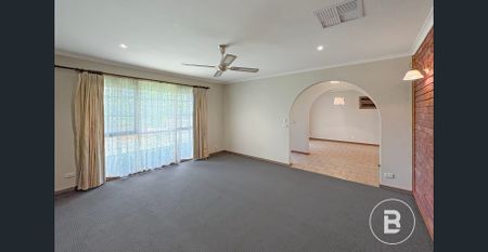 Spacious Home with Two Livings and New Carpet - Photo 2