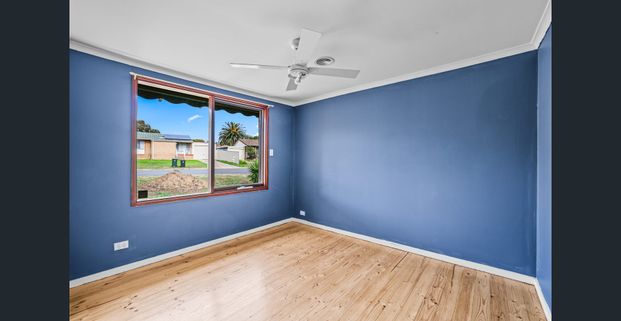 Family home with large backyard and multiple living spaces - Photo 1