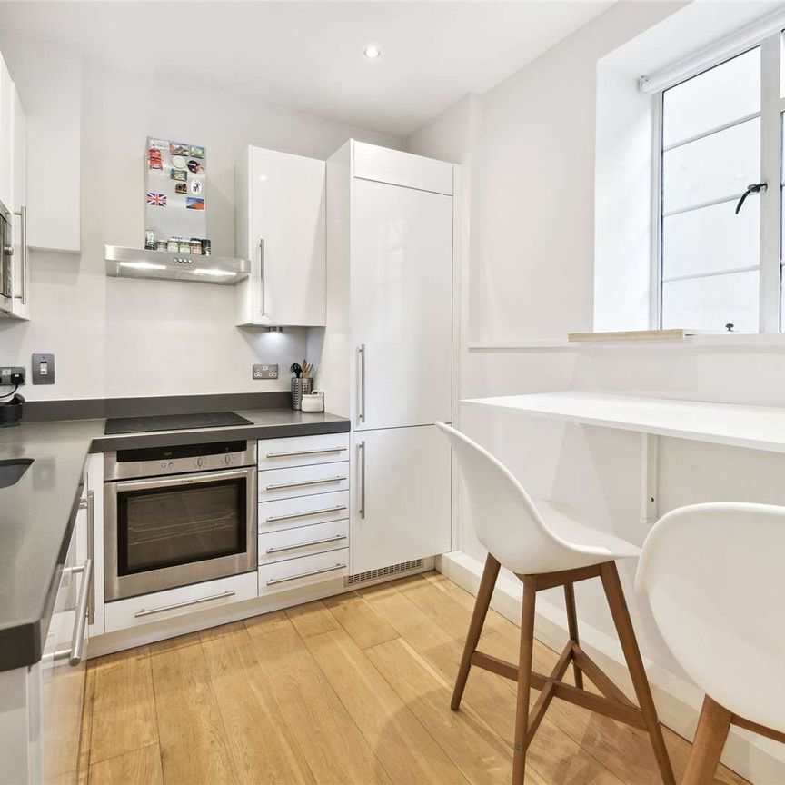 A lovely 3 bedroom flat, bright and modern in style, located on the first floor of a smart portered building in the heart of South Kensington, just off Brompton Cross. - Photo 1