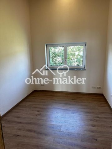 Doppelhaushälfte mit kleinem Garten - Foto 2