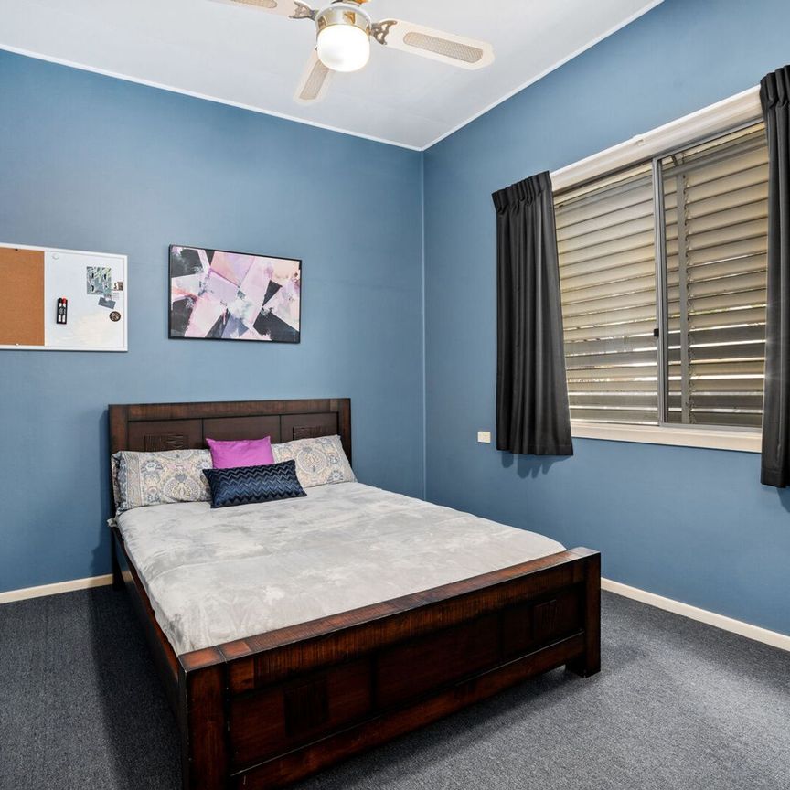 Charming Family Home with Spacious Living & Established Gardens - Photo 1
