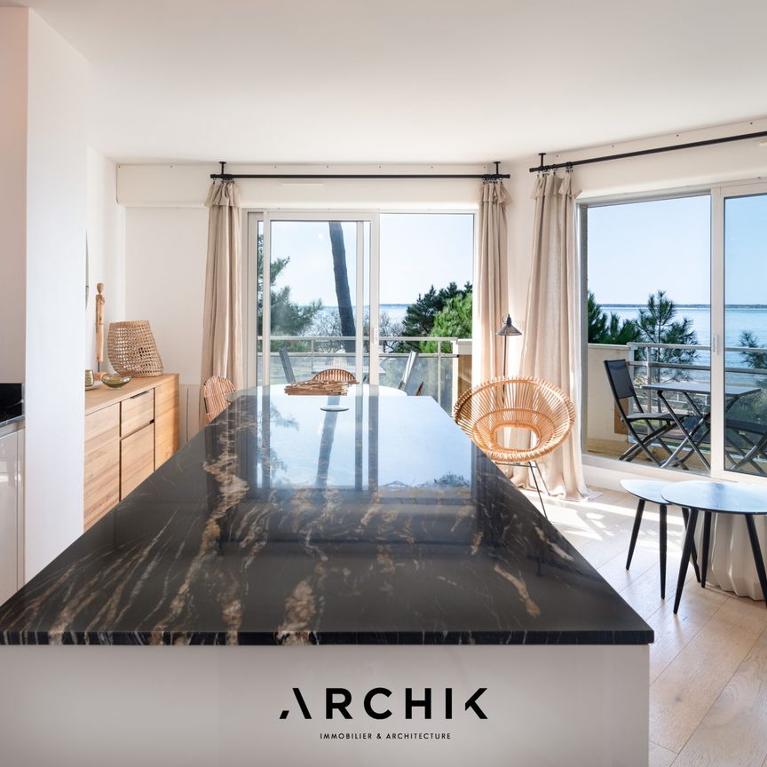 Architecture contemporaine, cet appartement de 60 m2 situé au premier étage d'une résidence standing installée au coeur d'un parc paysager, offre un accès direct à la plage du Moulleau. - Photo 1